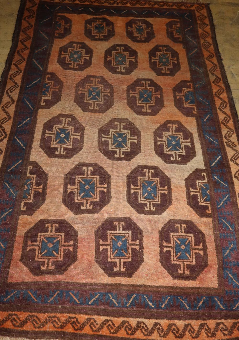 A Turkish peach ground rug, 200 x 134cm